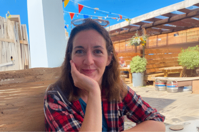 Lisa smiling sitting at a table